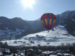 Hot air ballooning in front of Praz sur Arly ski slopes